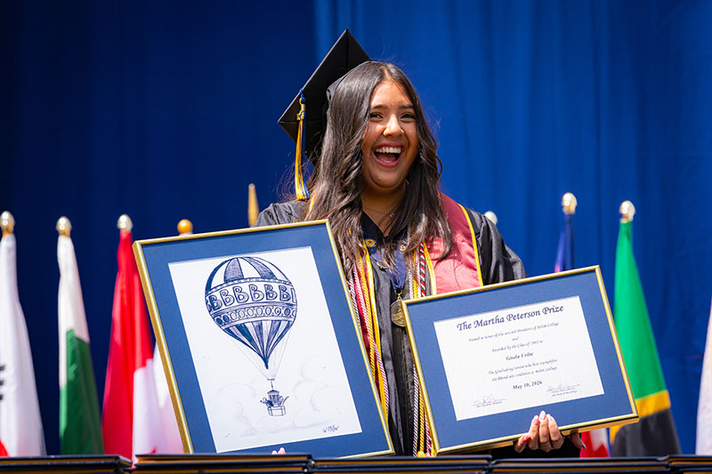 A student smiling. Links to Gifts of Cash, Checks, and Credit Cards