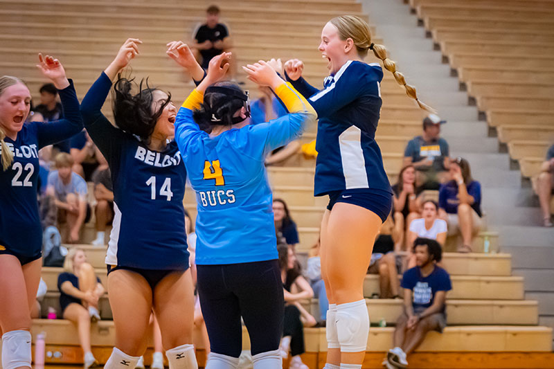 Student athletes cheering in a vollyball game. Links to Tangible Personal Property